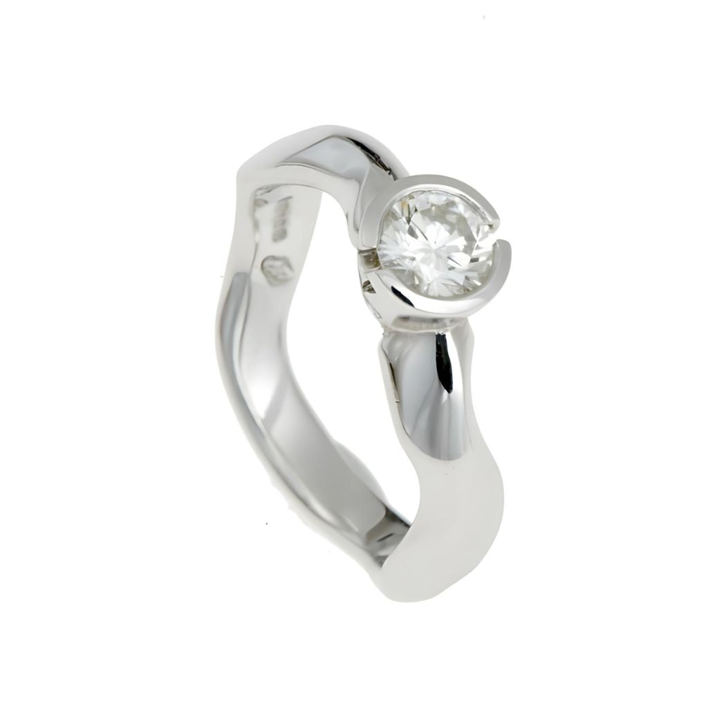 Carved round diamond solitaire in platinum