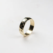 Intricately engraved cross detail around this 9ct gold ring is hand carved and measures 6mm in width.