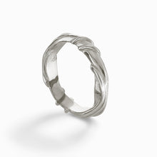 Crafted with precision, this medium-width ring features a unique entwined design that seamlessly marries contemporary style with a hint of vintage charm. The 5mm band, sculpted from high-quality silver, showcases Jeremy Hoye's exceptional craftsmanship and eye for detail, making it a perfect accessory for any occasion.