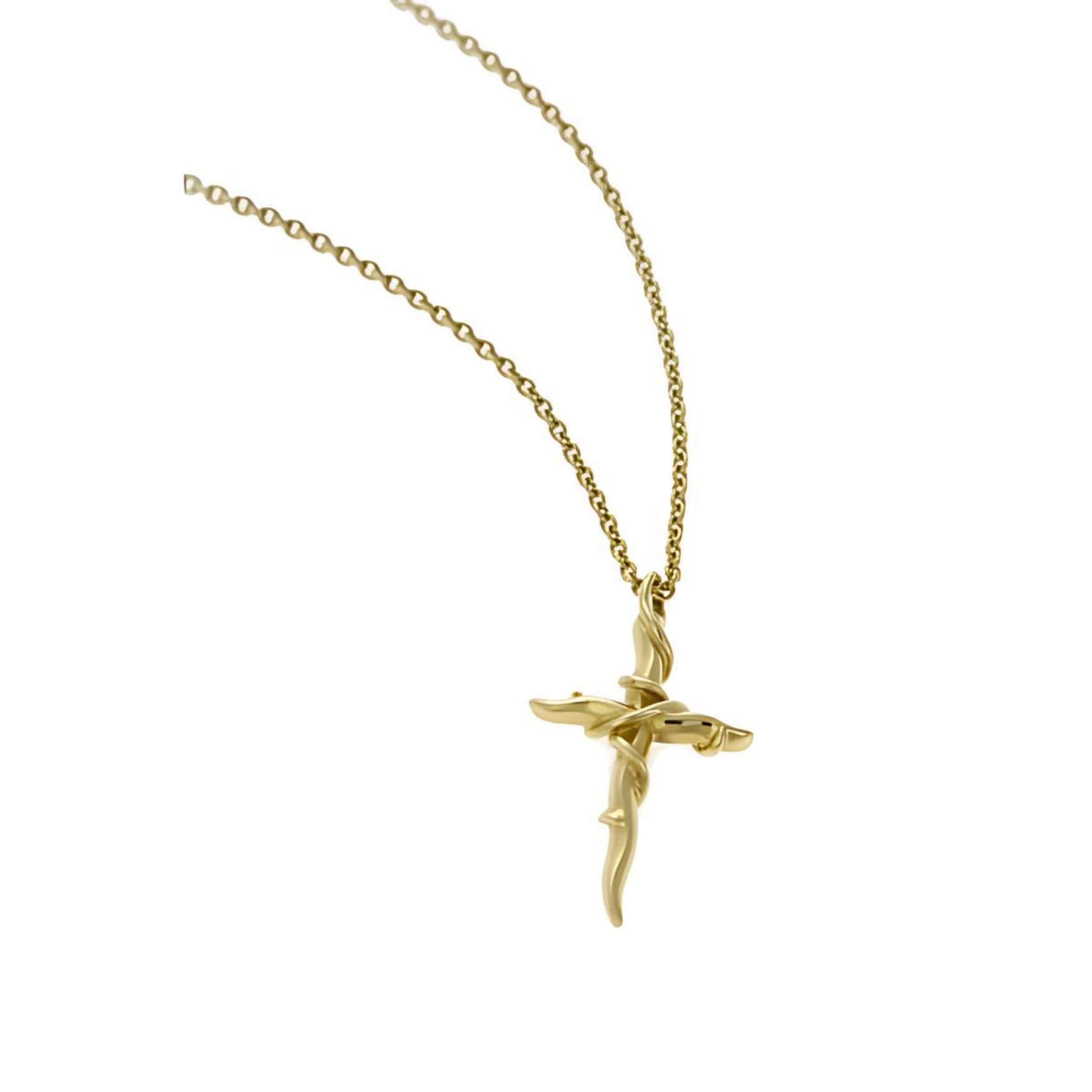 The pendant, meticulously crafted from 9ct yellow gold, is adorned with intricate vines, creating a signature Entwine Cross design. Hanging gracefully from an 18-inch fine trace chain and secured with a reliable trigger clasp, this necklace is perfect for any occasion.