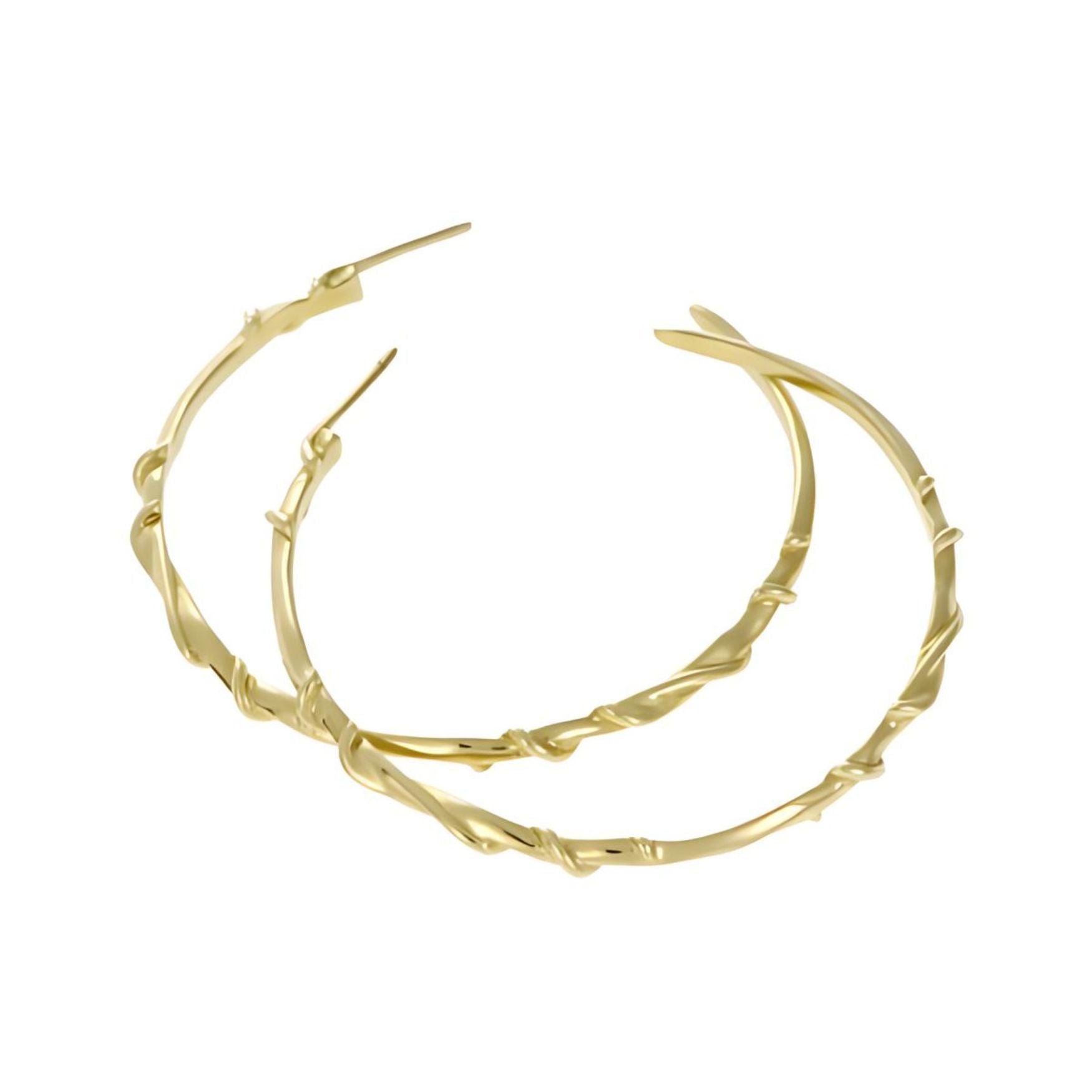 These exquisite earrings measure 4cm in diameter, showcasing a bold yet elegant design. Crafted from luxurious 9ct yellow gold, each hoop is intricately detailed with the collection's signature wrapped vines, adding a touch of character.