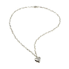 This 16" necklace is meticulously handcrafted with uniquely designed silver links that interlock gracefully, embodying the distinctive charm of the Entwine collection. A beautifully polished heart charm dangles at its centre, adding a touch of romantic allure.