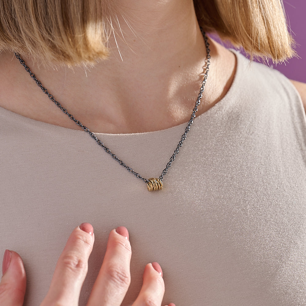 Silver Gold plated pendant on an 18" oxidised silver chain.