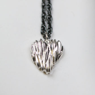 Silver heart pendant on an 18" oxidised finish silver chain.