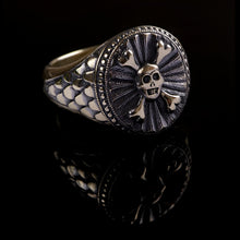 From the Hoye Division collection is the 9ct yellow gold oval skull crossbones traditional style signet ring with black rhodium finish from the Hoye Division Collection.