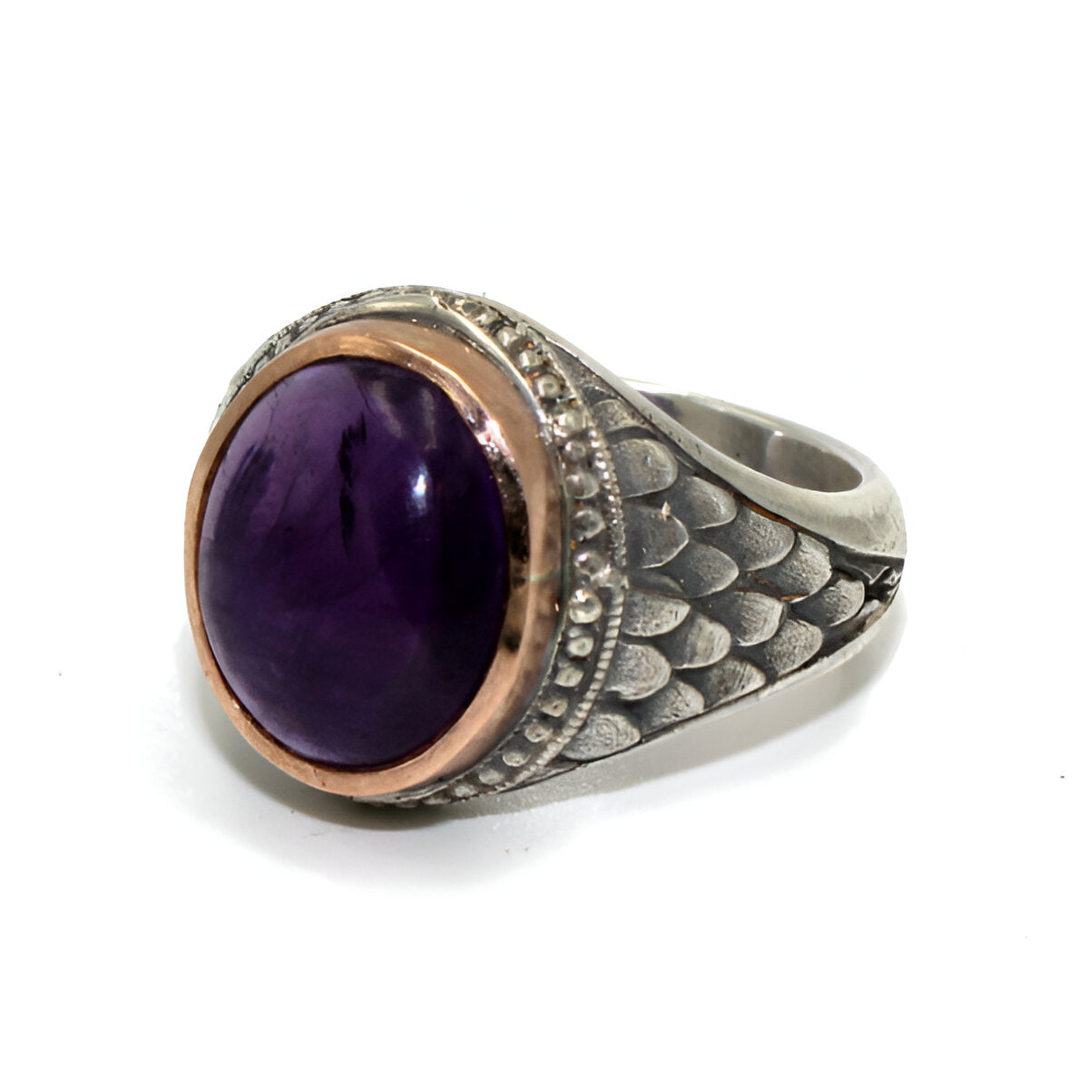 This silver college style ring is handmade in solid silver with a 9ct rose gold setting and oval cabochon amethyst.