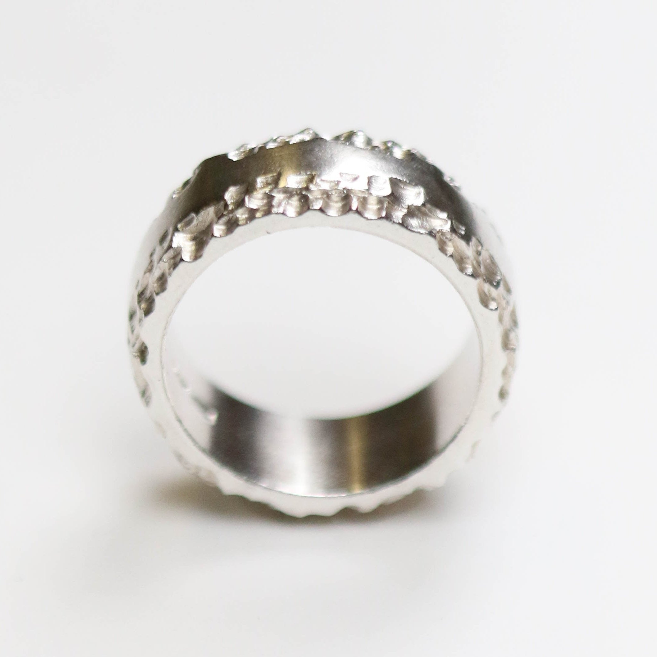 Luna Silver wide flat centred textured detail ring measuring 14mm in width.