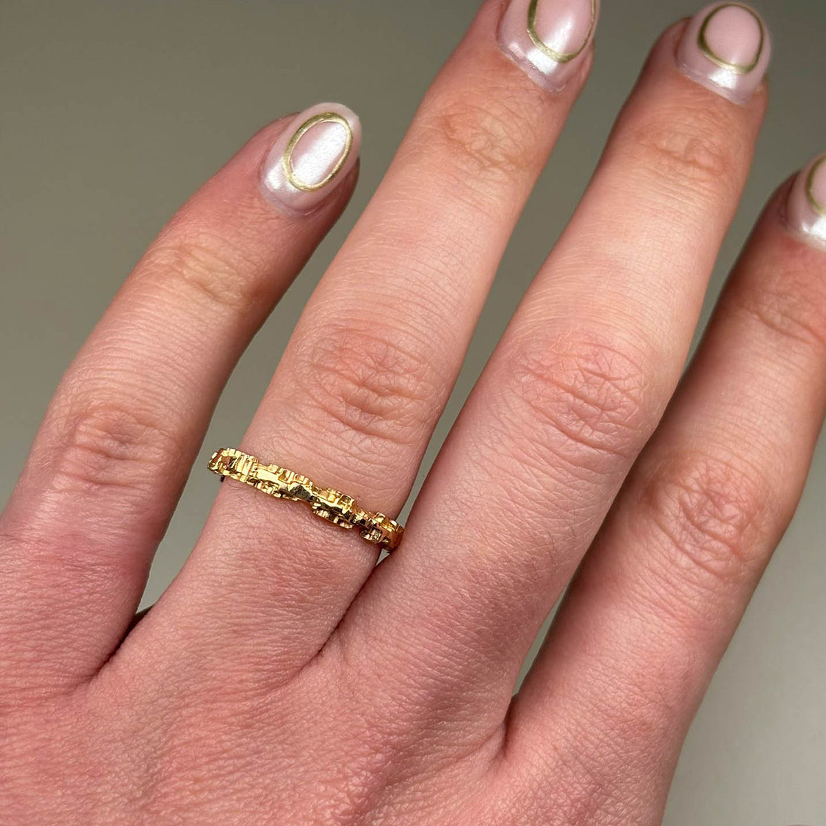 A unique and versatile textured band ring from Jeremy's Luna collection. This stackable piece measures 2.5mm in width.