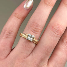 This unique solitaire is hand carved in 18ct rose gold, and set in platinum with a beautiful .56pt princess cut diamond.