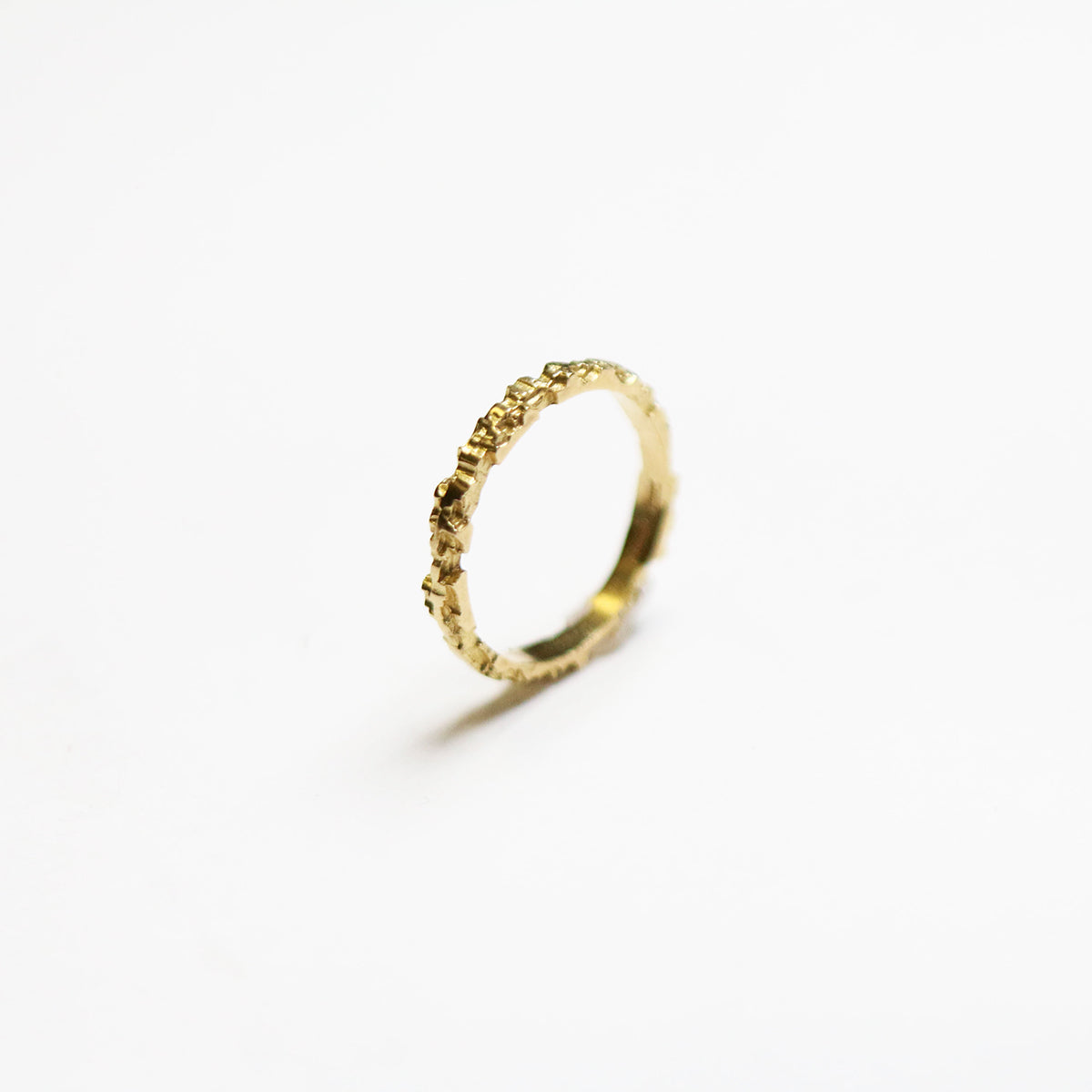 A unique and versatile textured band ring from Jeremy's Luna collection. This stackable piece measures 2.5mm in width.