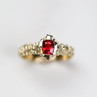 This unique solitaire is hand carved in 9ct yellow gold 3mm band width, set with a beautiful .58pt ruby.