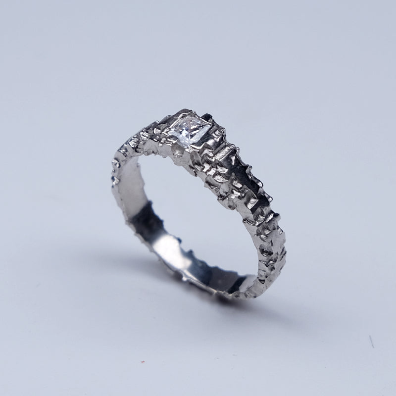 The Luna Platinum solitaire is hand carved and set with a beautiful 0.25pt princess cut diamond. 