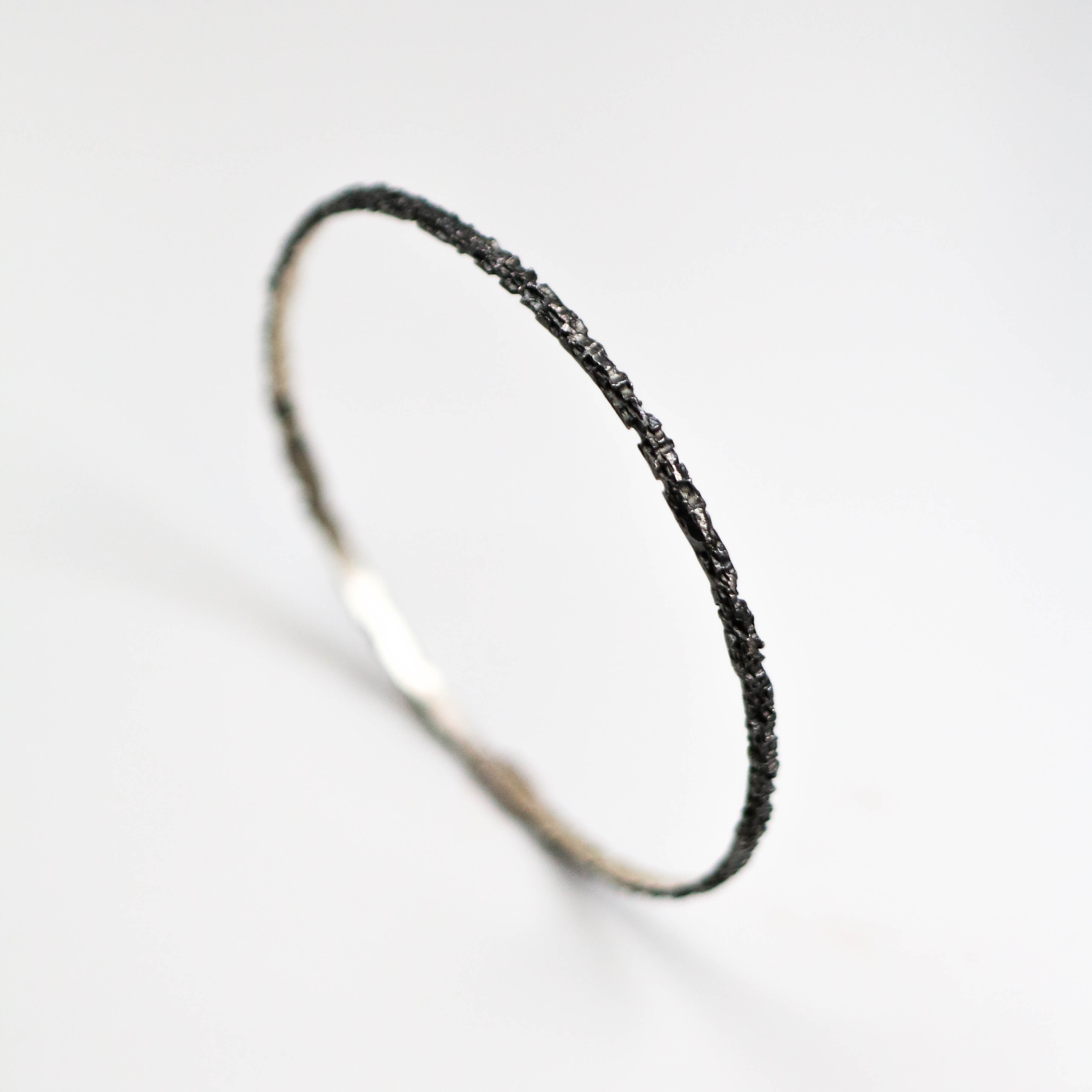 Luna silver oxidised textured bangle. This bangle measures around 3mm in width and look great both on its own and stacked with other bracelets.