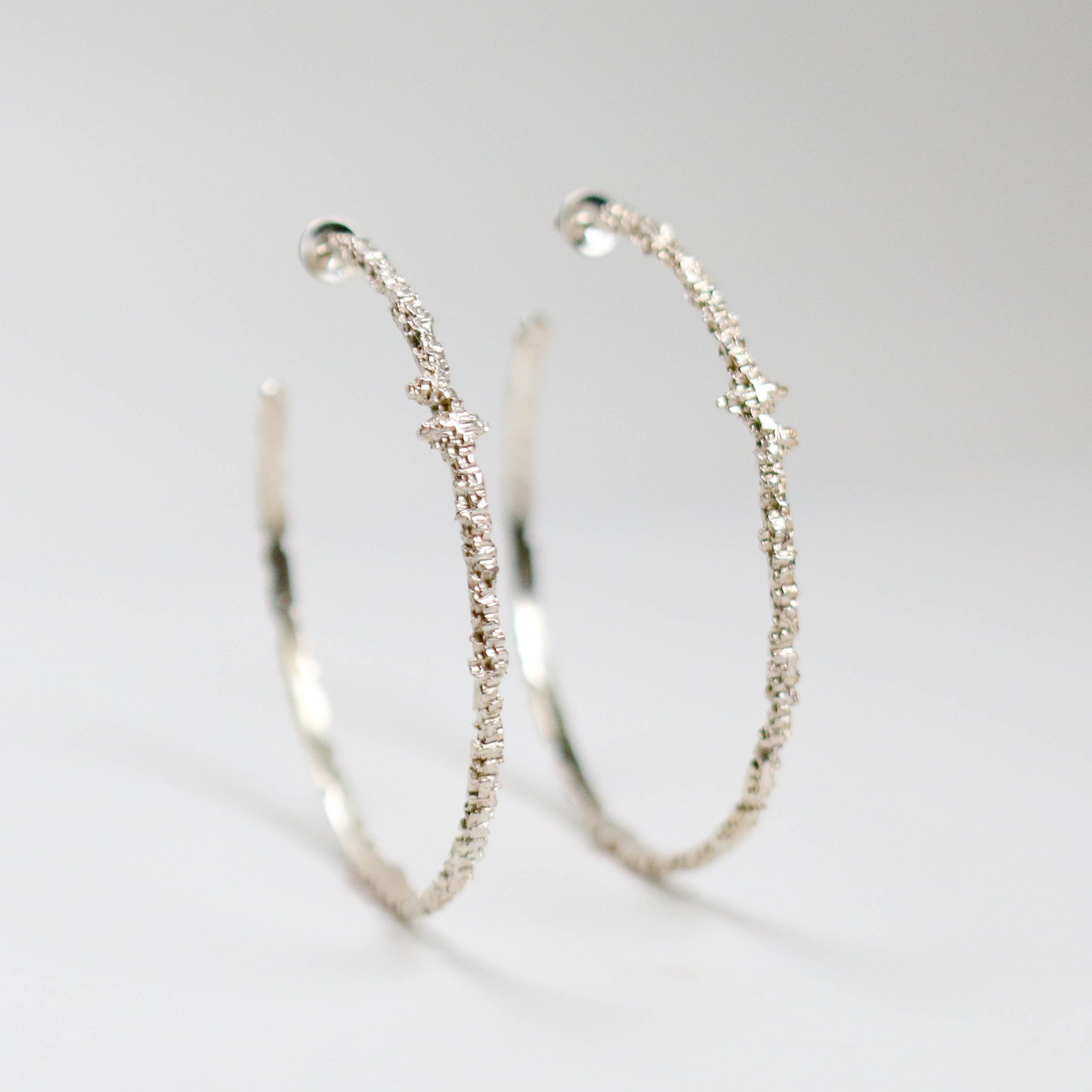 Luna silver large textured hoops measuring at 3mm in width and looks great both on it's own and stacked with other earrings.