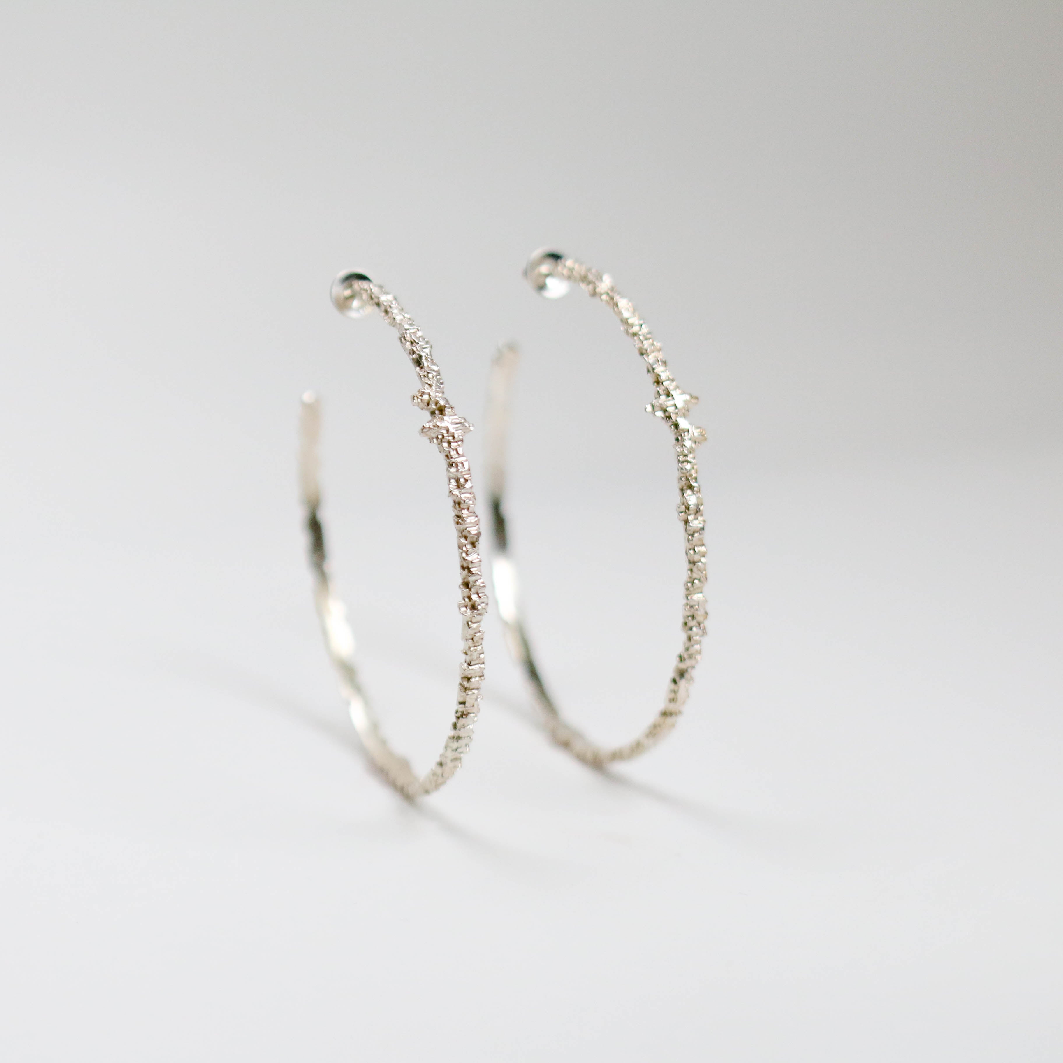 Luna silver large textured hoops measuring at 3mm in width and looks great both on it's own and stacked with other earrings.