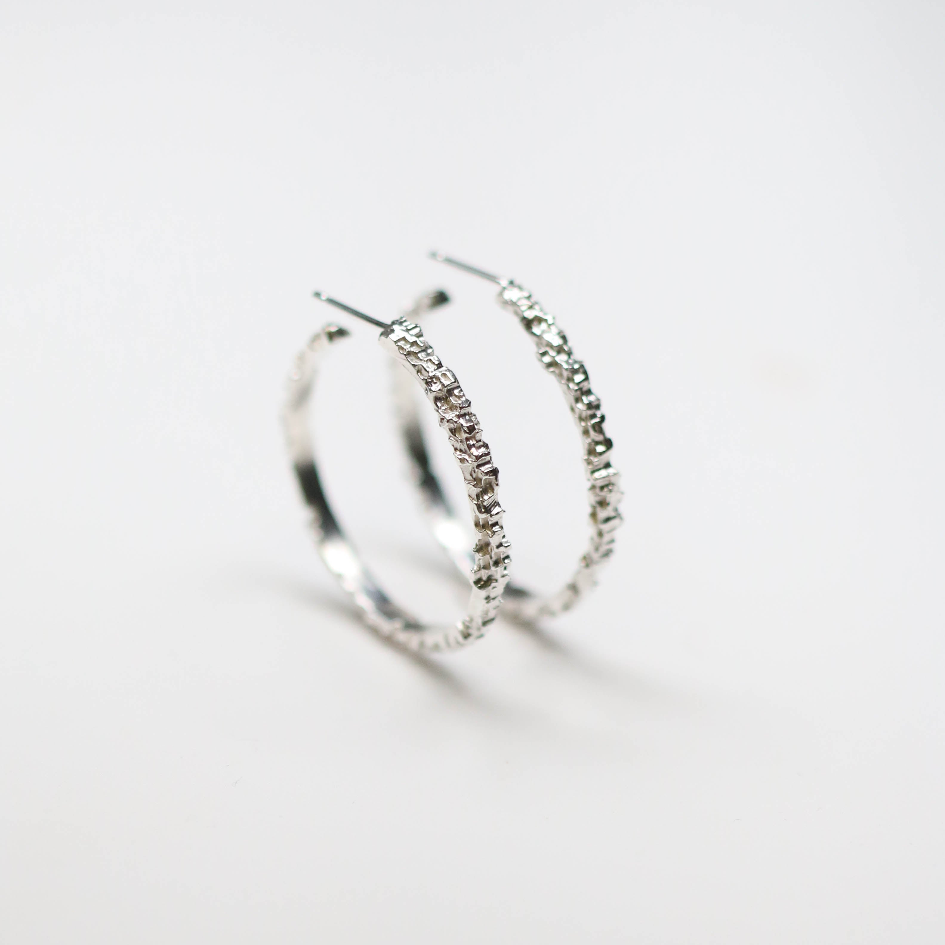 Luna silver textured hoops. Handmade in sterling silver, these earrings measure at 30mm circumference with a 3mm width.