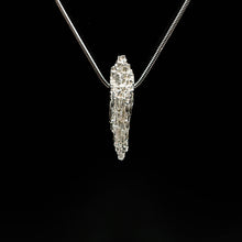 This Luna textured pendant by Jeremy Hoye hangs on an 18" silver snake chain.