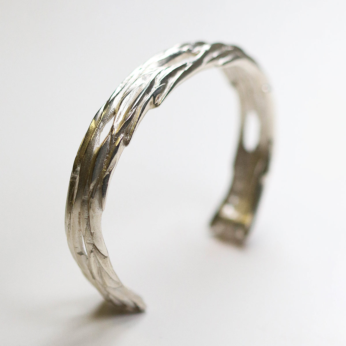 Forest Silver Bangle. The detail resembles bark from oak forests.