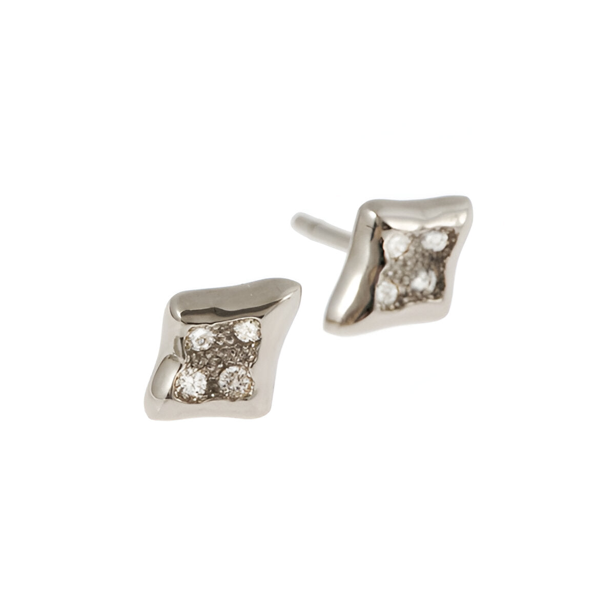 Each stud is handmade in 18ct gold and pavé set with four .03pt brilliant cut diamonds.