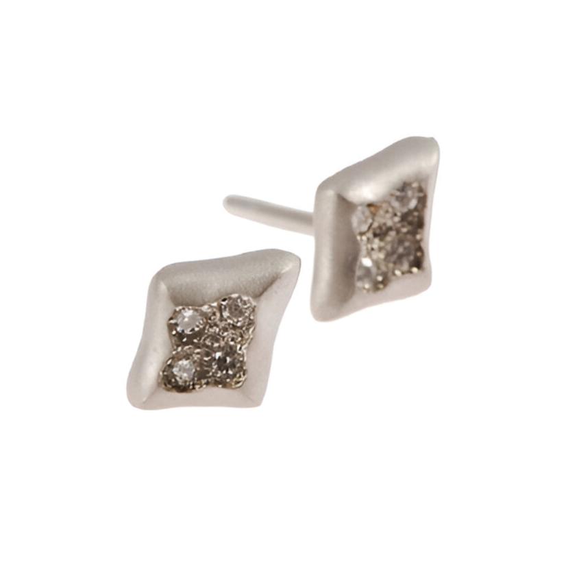 Each stud is pavé set with four round, brilliant cut diamonds. The inlaid detail helps to protect the stones, making these earrings hard-wearing and perfect for everyday wear.