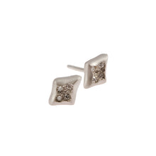 Each stud is pavé set with four round, brilliant cut diamonds. The inlaid detail helps to protect the stones, making these earrings hard-wearing and perfect for everyday wear.