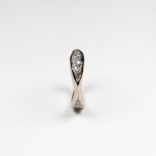 Measuring 3mm at its widest point, with 26 pavé set white diamonds.