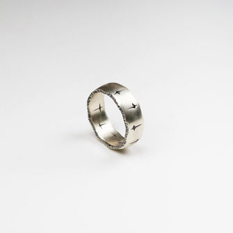 Trinity 18ct white gold band measuring 8mm in width. Set with 10 black diamonds which total .30pts of a carat.