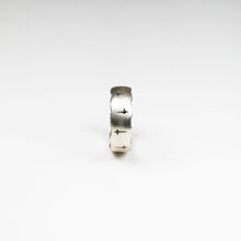 Trinity 18ct white gold band measuring 8mm in width. Set with 10 black diamonds which total .30pts of a carat.