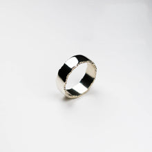 Trinity textured edge ring measuring 8mm in width in white gold.