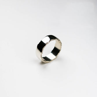 Trinity textured edge ring measuring 8mm in width in white gold.