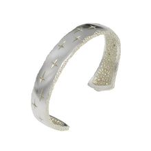 Trinity silver cuff measuring 10.5mm in width. This cuff can also be finished with gold plate detail.