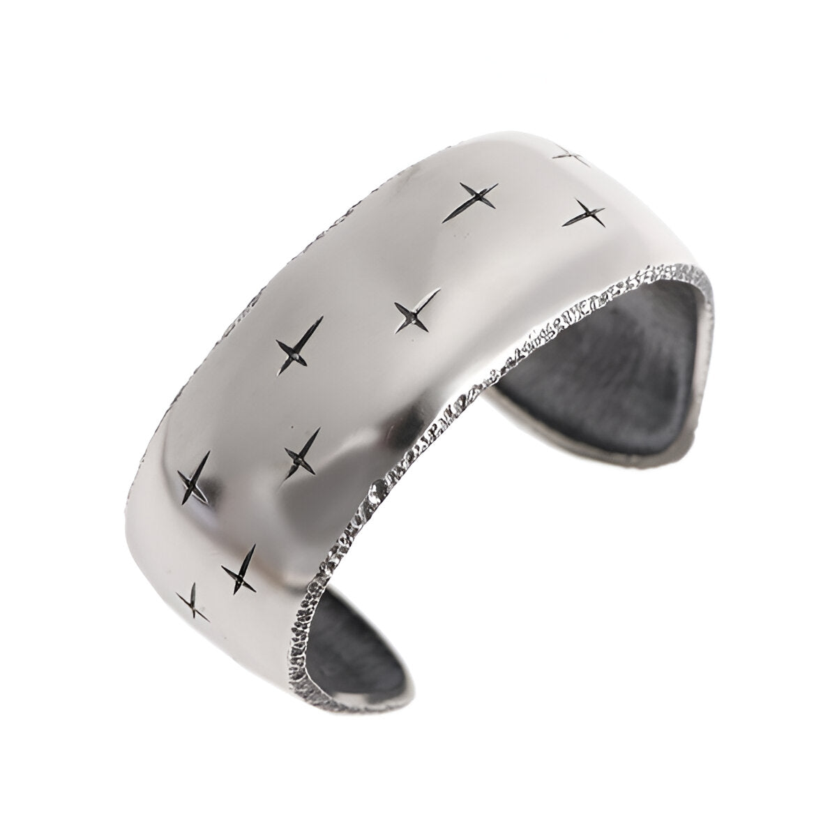 Trinity silver wide cuff, with textured edges and cross detail. This cuff is a strong bold piece from Jerremy Hoye's cult favourite Trinity collection.