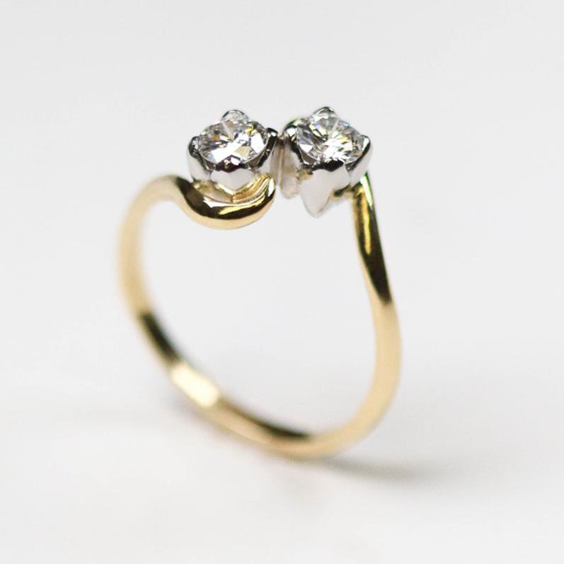 A popular collection, Tulip, handmade in 18ct yellow gold featuring two .25pt diamonds set on a platinum tulip petal.