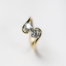 A popular collection, Tulip, handmade in 18ct yellow gold featuring two .25pt diamonds set on a platinum tulip petal.