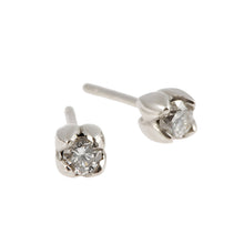 Two stunning round, brilliant cut 2x0.25pt white diamonds total weight. Set delicately in a tulip petal settings.