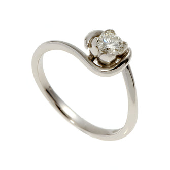 A simple, fine band handmade in platinum. Petal setting with modest .25pt round, brilliant cut diamond.