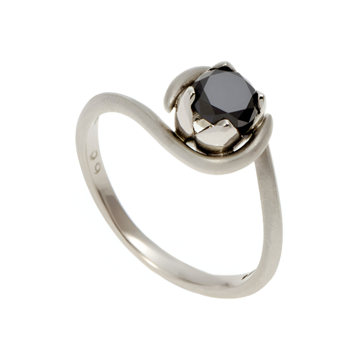 A simple, fine band with a delicate petal setting which features a striking .75p round, treated black diamond.