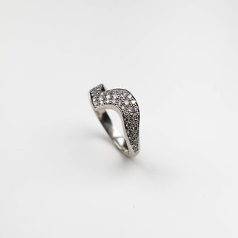 Handmade in Platinum this stunning piece is pavé set with white diamonds. This ring measures 6mm at its widest point and tapers down to 3mm.