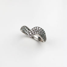 Handmade in Platinum this stunning piece is pavé set with white diamonds. This ring measures 6mm at its widest point and tapers down to 3mm.